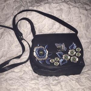 Embroidered black cross body bag
